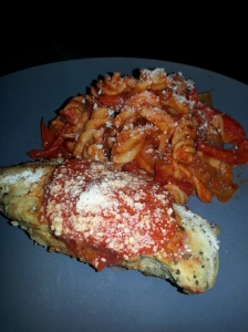 Lightly breaded chicken parm with red peppers and rotini
